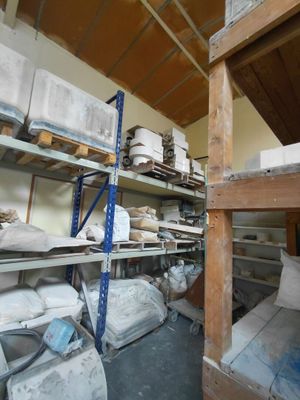 a room filled with lots of boxes and shelves