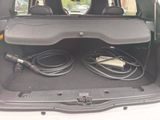 a trunk of a car with a bunch of wires in it