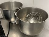 two bowls and a whisk on the kitchen counter