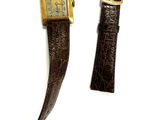 pair of brown leather watch straps with gold buckles on a white surface