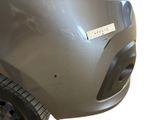 the front bumper of a car with a sticker on it