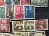 several different types of stamps are on display in a glass case