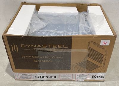 packaging of a box with a laptop inside of it sitting on a floor