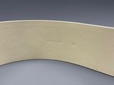 a close up of a belt on a gray surface
