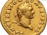 a gold coin with an image of a man on it