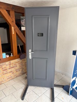 a grey door in the corner of a room