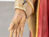 statue of a hand with a ring on it ' s wrist