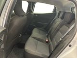 the back seats of a car with the door open and the driver ' s seat down