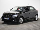 a picture of a black car parked in a room