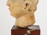 marble head of a young boy on a marble base
