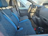 a blue seat cover in the back of a car