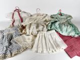 a lot of clothes that are on a white surface