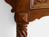 a close up of a wooden table with carvings on it