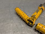 a yellow toy airplane that is laying on a metal surface