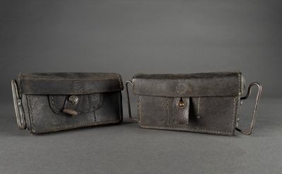 pair of vintage leather wallets on grey background