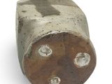 a close up of a piece of wood that has holes in it