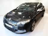 a picture of a black car parked in a white room