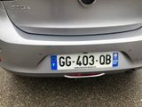 a silver car parked on the side of the road