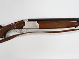 a shotgun with a wooden body and a wooden handle
