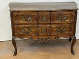 an image of a wooden chest of drawers sitting on top of a hard wood floor
