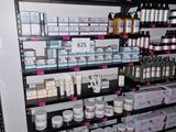 many different types of skin care products on the shelves