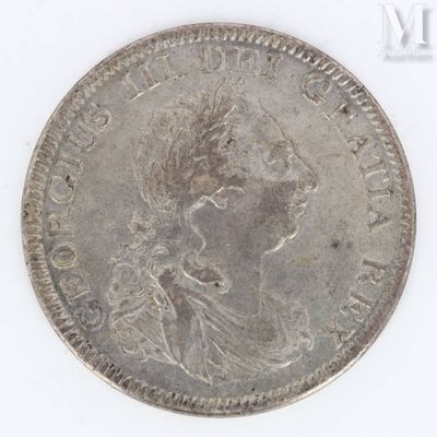 a close up of a coin on a white surface