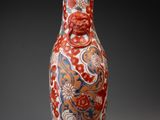a vase that has a red and blue design on it