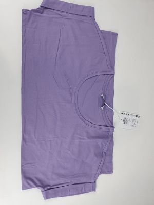 the purple shirt is laying on a white surface next to a pair of scissors