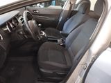 the interior of a car with a black seat cover and a steering wheel