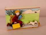 painting of a man sitting on a bench with a suitcase and a dog