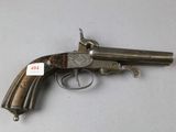 a close up of a gun on a table with a tag on it