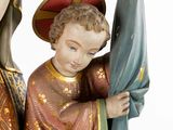 a statue of a woman holding a child on her lap