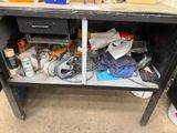 an image of a workbench with a lot of clutter on it