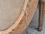 a close up of a chair with a cushion on it