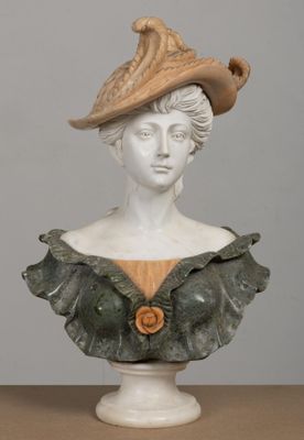 a bust of a woman wearing a hat on a table