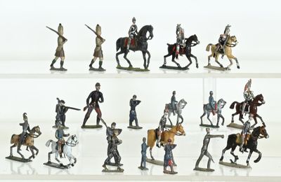 many figurines of men riding horses and horses