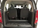 two seats in the back of a van with the door open
