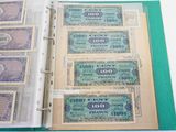 a binder with a lot of different bills inside of it