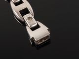 an image of a close up of a silver chain with diamonds