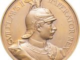 an image of a gold medal with a man in a helmet on top of it