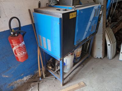 a blue cabinet with a fire extinguisor next to a fire hydrant