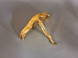 a gold colored object that is on a table