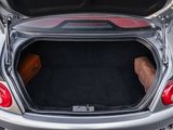 a trunk of a silver car with its trunk open