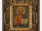 une vieille image de Jésus tenant un morceau de papier dans un cadre en bois