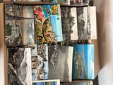 a box full of postcards that are sitting on a table