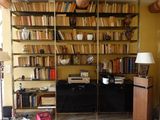 a room that has a lot of books on the shelves