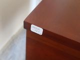a close up of a wooden table with a label on it