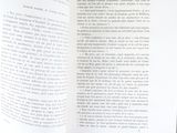 an open book with a picture of a cat sitting on top of it