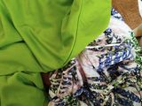 a mannequin with a green shirt and a green scarf