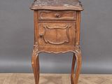 an old wooden table with a drawer on top of it